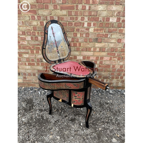 103 - An unusual black laquered vanity chest with fold over top to reveal mirror and leather surface