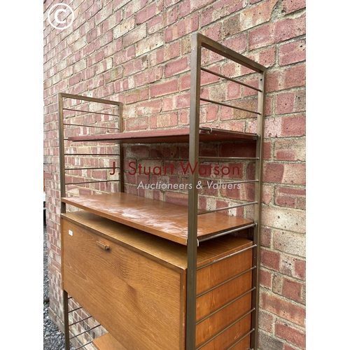 113 - A ladderax home office system with a bureau desk and four shelves. Gold uprights