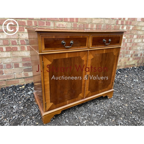 12 - A reproduction yew wood sideboard 90cm wide