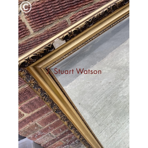 124 - A gold gilt framed mirror together with a rectangular silver mirror