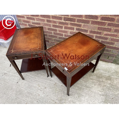 126 - A pair of reproduction mahogany lamp tables fitted with brown leather tops, each having a single dra... 