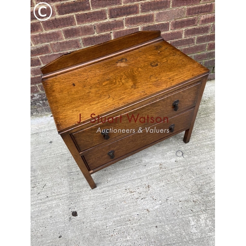 127 - An oak chest of two drawers