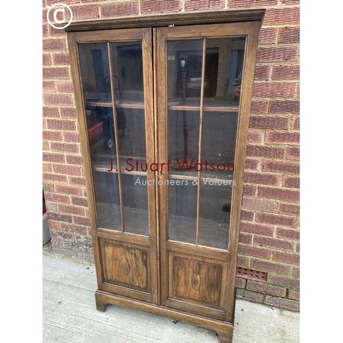 139 - An early 20th century glazed bookcase