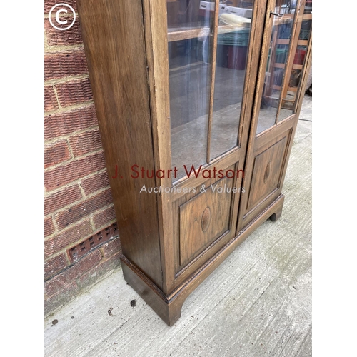 139 - An early 20th century glazed bookcase