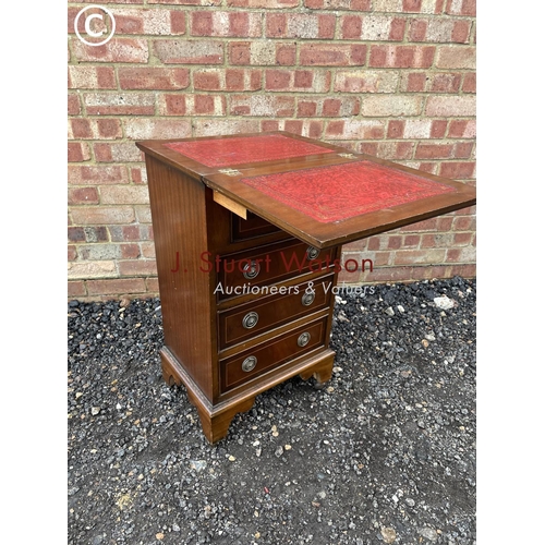 14 - A small reproduction mahogany batchelors chest with red leather fold over top