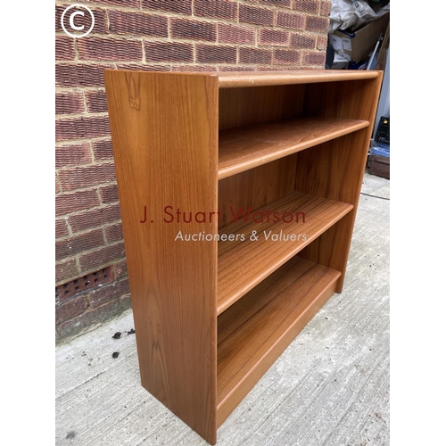 141 - A teak open fronted bookcase