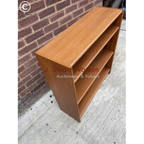 141 - A teak open fronted bookcase