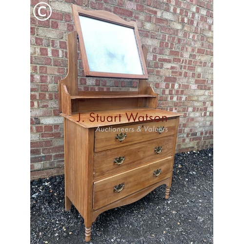 15 - A satinwood three drawer dressing table