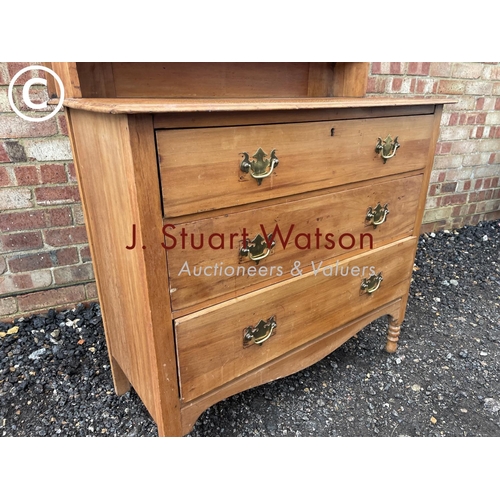 15 - A satinwood three drawer dressing table