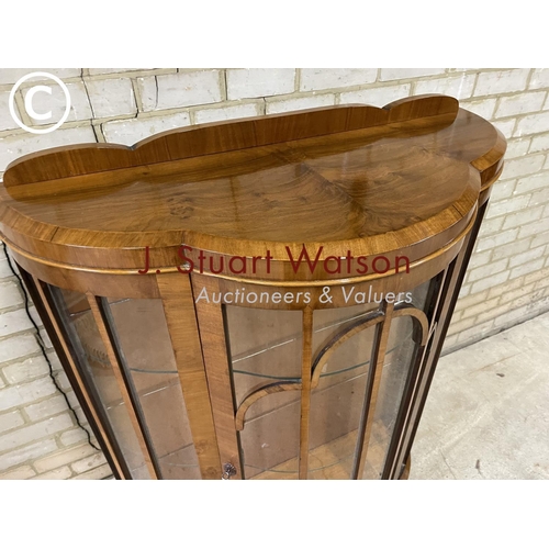 159 - A 1940's walnut display cabinet with three glass internal shelves