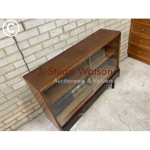 164 - A mid century glazed teak bookcase