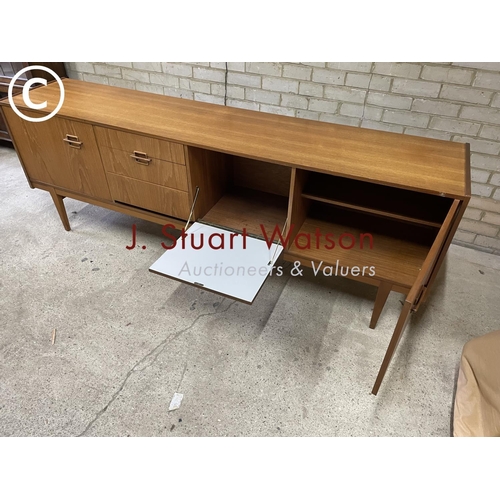 165 - A mid century teak coctail sideboard by Nathan