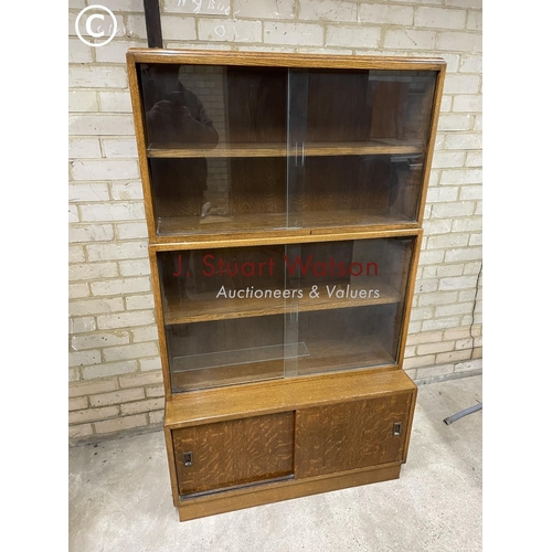 181 - A glazed oak three section bookcase