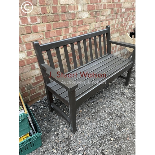 185 - A wooden garden bench