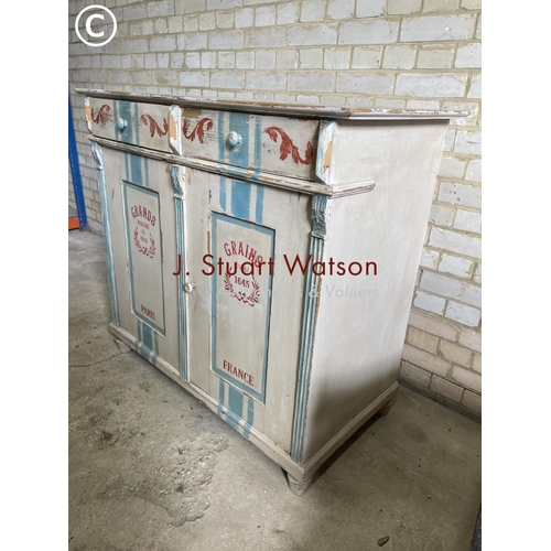 187 - A continental painted sideboard with two drawers over two cupboard doors