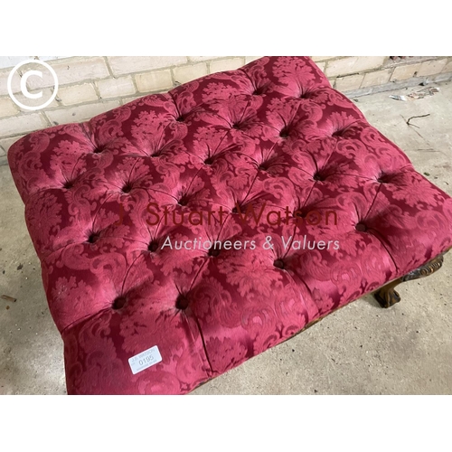 195 - A red upholstered buttoned footstool with ball and claw feet