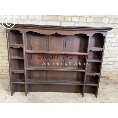 197 - An antique oak plate rack