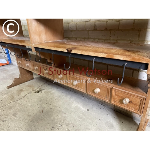 198 - A large farmhouse style pine butchers rack with a row of 8 drawers and a row of metal hooks