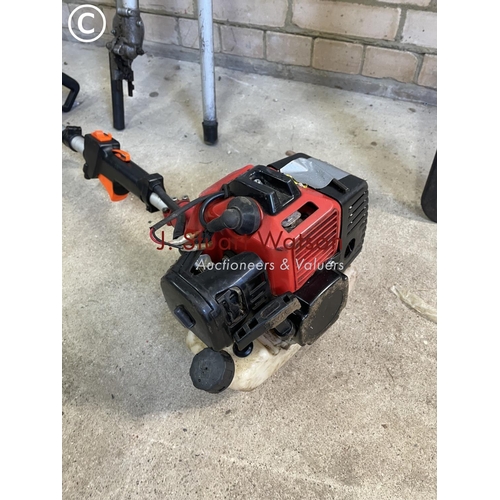 207 - A petrol pole saw trimmer with saw and hedge cutting attachments