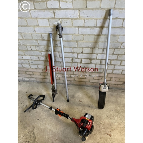 207 - A petrol pole saw trimmer with saw and hedge cutting attachments