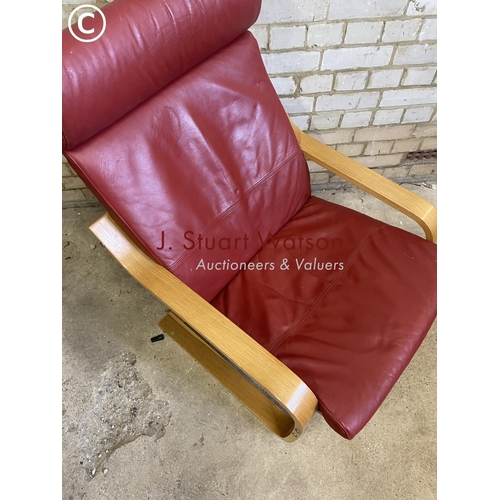 231 - An red leather cantilever chair