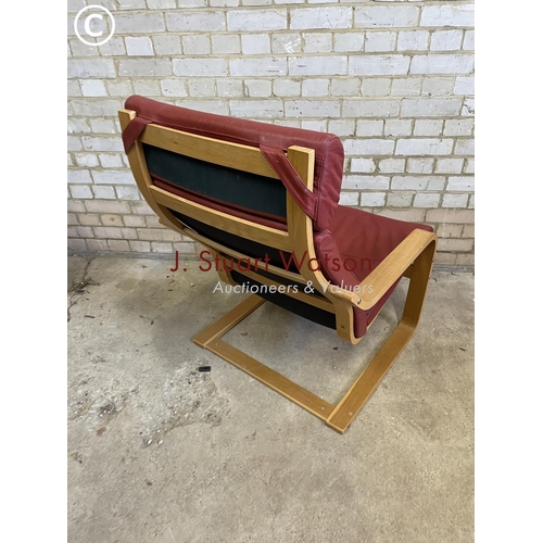 231 - An red leather cantilever chair