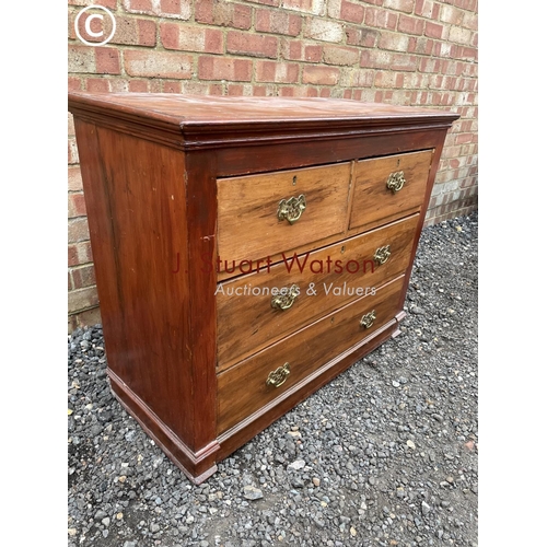 255 - A satinwood chest  of four drawers