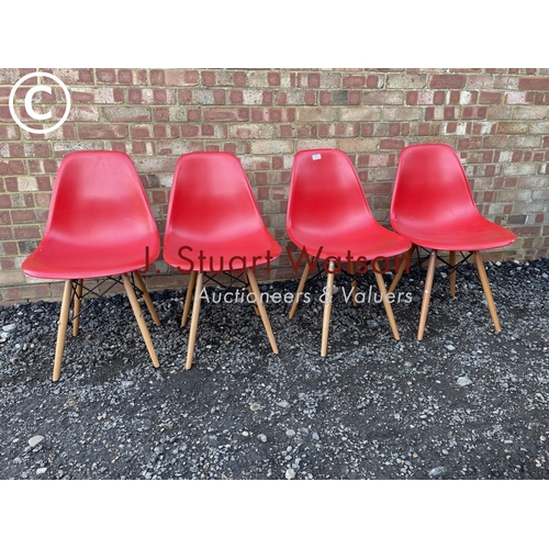 26 - A set of four modern Eames style chairs in red