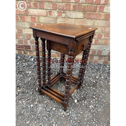 269 - An oak nest of three tables with drawer