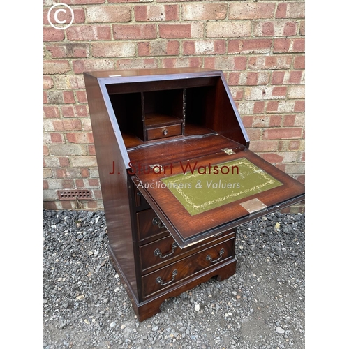 271 - A reproduction mahogany bureau with a fitted interior