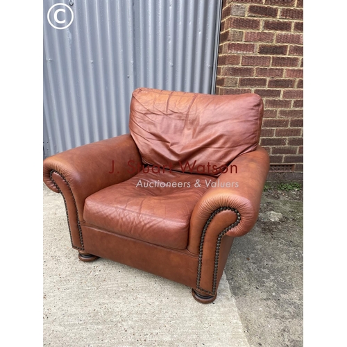 275 - A tan brown leather club style chair