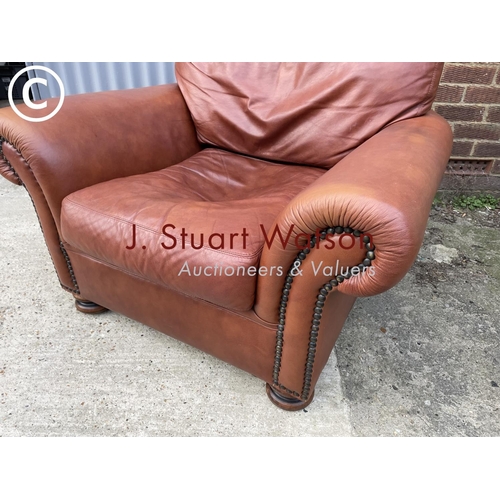 275 - A tan brown leather club style chair