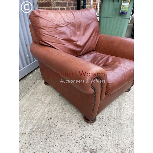 275 - A tan brown leather club style chair