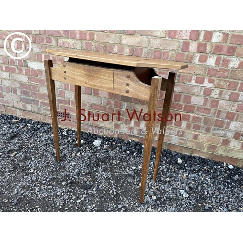 28 - An unusual hardwood single drawer hall table