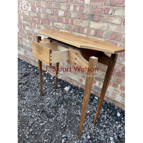 28 - An unusual hardwood single drawer hall table