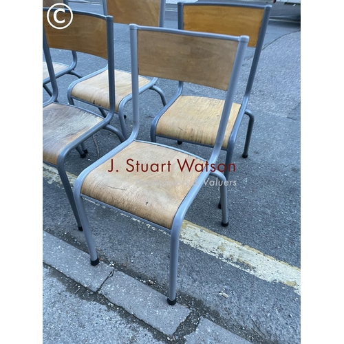 300 - A set of six md century stacking chairs with metal framed and ply seats