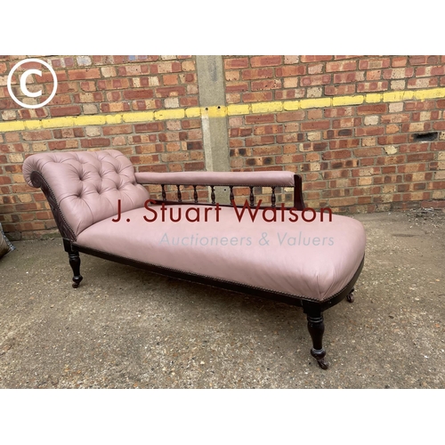 303 - An Edwardian chaise longue upholstered in mauve leather