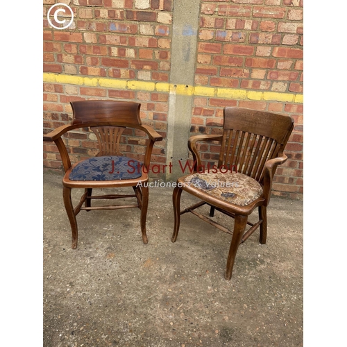 304 - An oak smokers bow back chair together with a mahogany desk chair