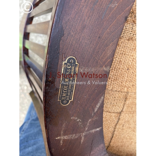 304 - An oak smokers bow back chair together with a mahogany desk chair