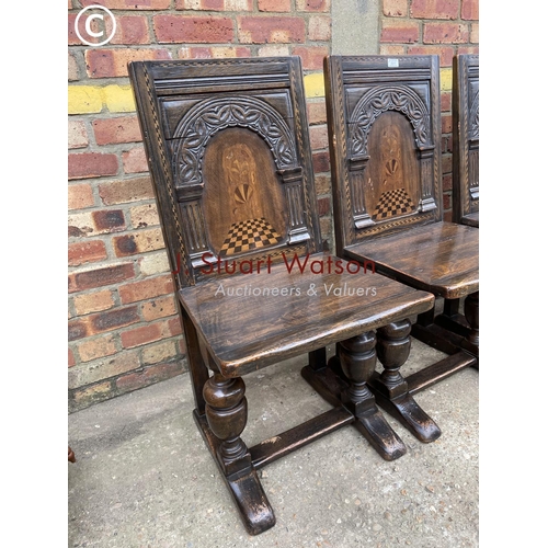 311 - A set of four oak panel back chairs with inlay