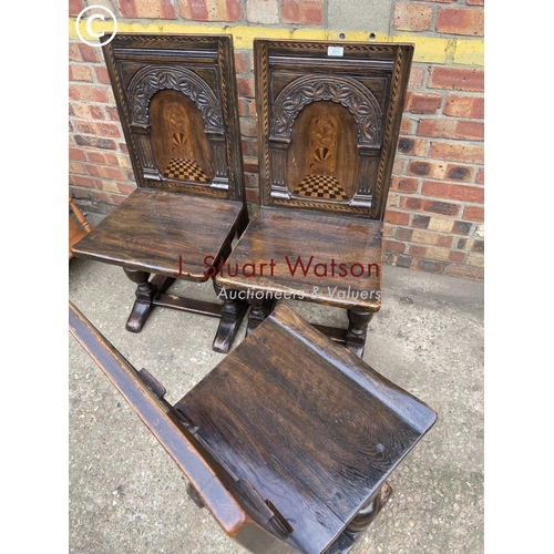 311 - A set of four oak panel back chairs with inlay