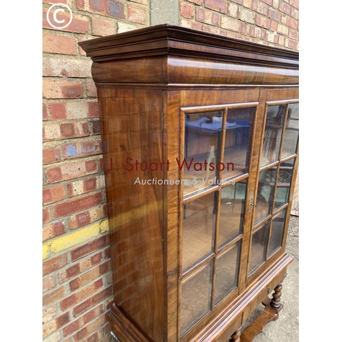 314 - A reproduction walnut display cabinet on two drawer stand with two oak adjustable shelves   110x44x1... 