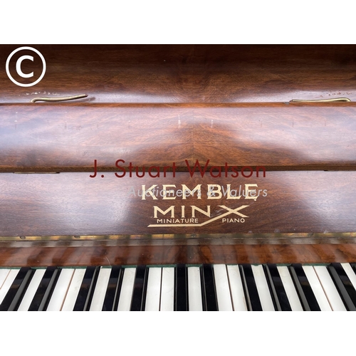 315 - A compact walnut cased Kemble Miniature piano 133wide