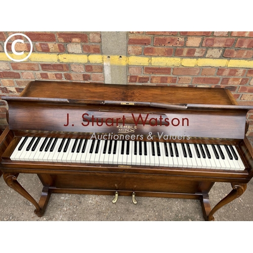 315 - A compact walnut cased Kemble Miniature piano 133wide