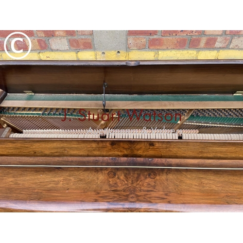 315 - A compact walnut cased Kemble Miniature piano 133wide