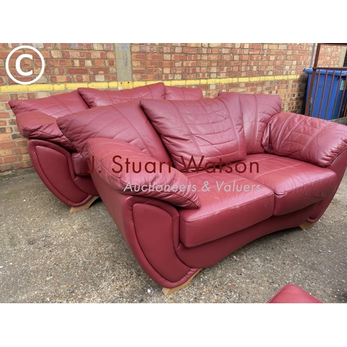 324 - A large modern red leather three piece lounge suite consisting of three starter sofa, two seater sof... 