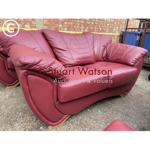 324 - A large modern red leather three piece lounge suite consisting of three starter sofa, two seater sof... 