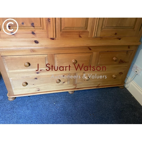 326 - A large solid pine double wardrobe on five drawer base 145x60x210