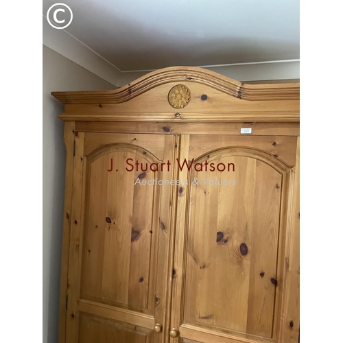 328 - A solid pine double wardrobe 120x60x210