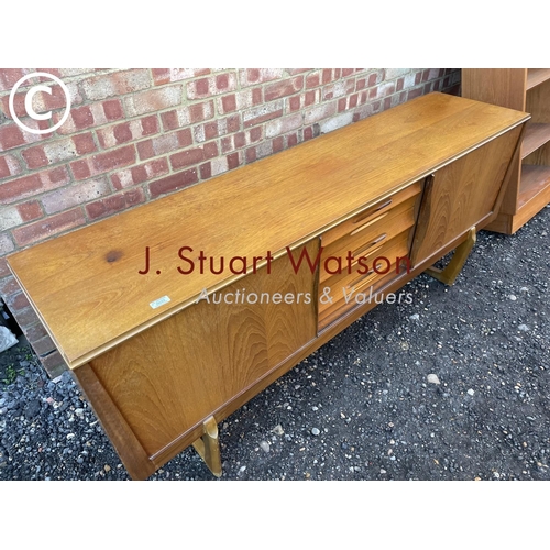 33 - A mid century teak sideboard by Elliots of Newbury  186x45x80